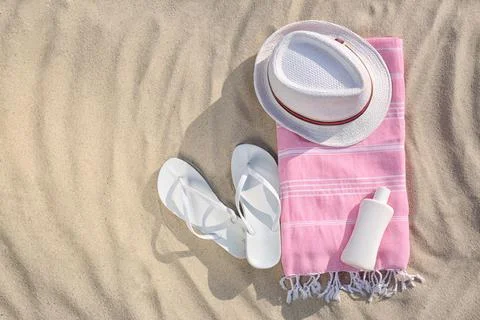 Flat lay composition with beach objects on sand, space for text Stock Photos