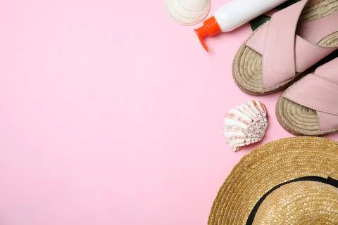 Flat lay composition with beach objects on pink background. Space for text Stock Photos