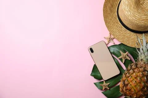 Flat lay composition with beach objects on pink background. Space for text Stock Photos
