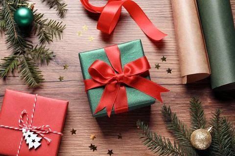 Flat lay composition with beautiful Christmas gift boxes and wrapping paper.. Stock Photos