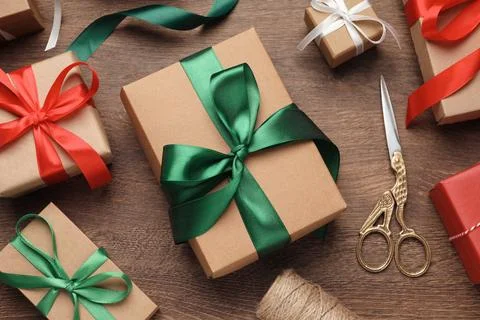 Flat lay composition with beautiful Christmas gift boxes on wooden table Stock Photos