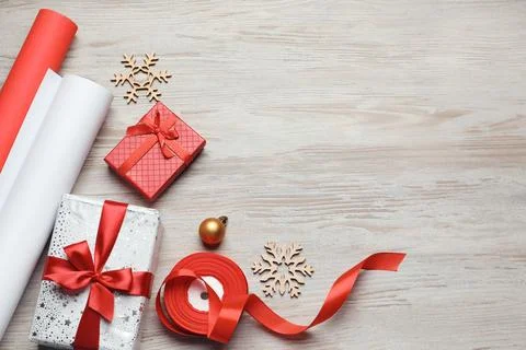 Flat lay composition with beautiful Christmas gift boxes and wrapping paper.. Stock Photos