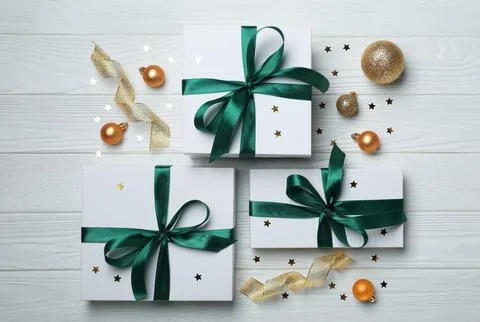 Flat lay composition with beautiful gift boxes and different Christmas deco.. Stock Photos