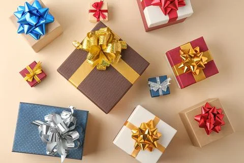 Flat lay composition with beautiful gift boxes on beige background Stock Photos