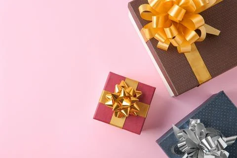 Flat lay composition with beautiful gift boxes on pink background. Space for  Stock Photos