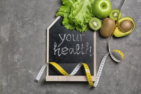 Flat lay composition with blackboard and fruits on gray background. Weight lo 스톡 사진