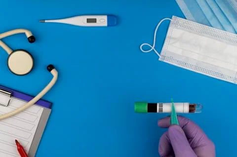 Flat lay composition with blood test tube and electronic thermometer 스톡 사진