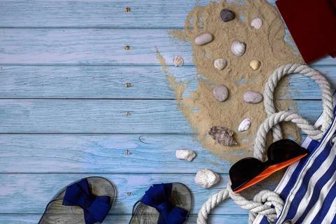 Flat lay composition on blue wooden background accessories for summer vacation Stock Photos