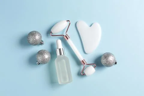 Flat lay composition with bottle of cosmetic oil and christmas balls Stock Photos