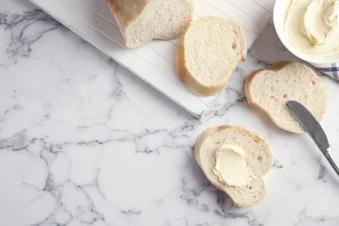 Flat lay composition with bread for breakfast on marble table. Space for text Stock Photos