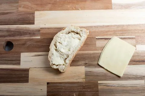 Flat lay composition of bread loaf on wooden board  rustic food scene Stock Photos