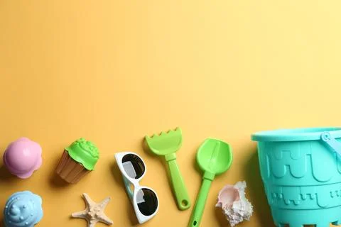 Flat lay composition with bright beach toys on color background. Space for te 写真素材