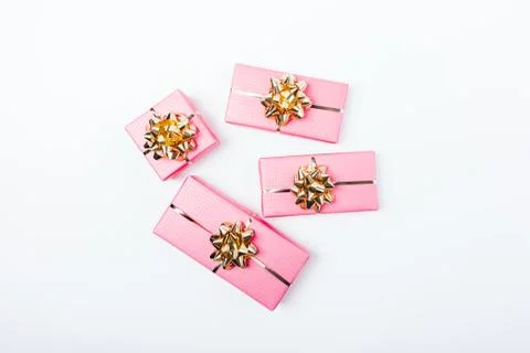 Flat lay composition of bright pink packaged gifts Stock Photos