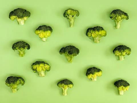 Flat lay composition with broccoli raw on color background green Stock Photos
