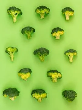 Flat lay composition with broccoli raw on color background green Stock Photos