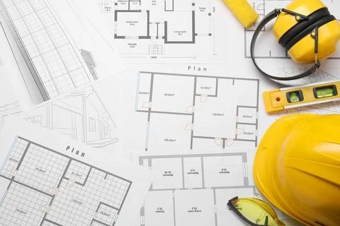 Flat lay composition with building level and other construction tools on pape Fotos de archivo