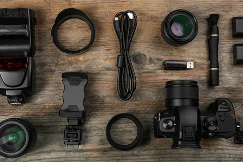Flat lay composition with camera and video production equipment on wooden tab Stock Photos