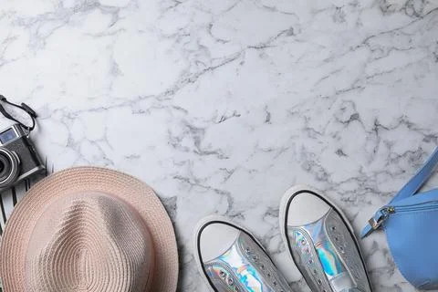 Flat lay composition with camera and blogger's stuff on marble background, sp Foto stock