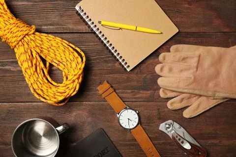 Flat lay composition with camping equipment on wooden background Stock Photos