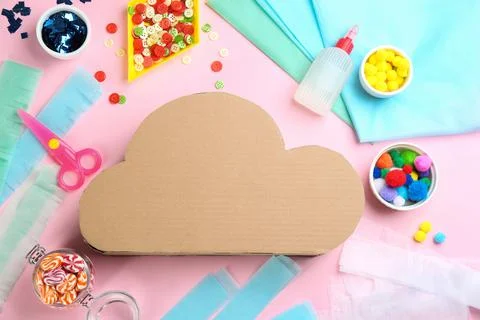 Flat lay composition with cardboard cloud on pink background. Pinata diy Stock Photos