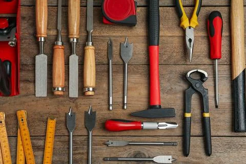 Flat lay composition with carpenter's tools on wooden background Stock Photos
