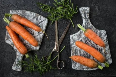 Flat lay composition with  carrots on  cutting board Stock Photos