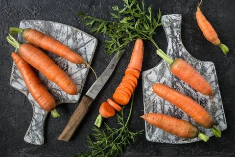 Flat lay composition with  carrots on  cutting board Stock Photos