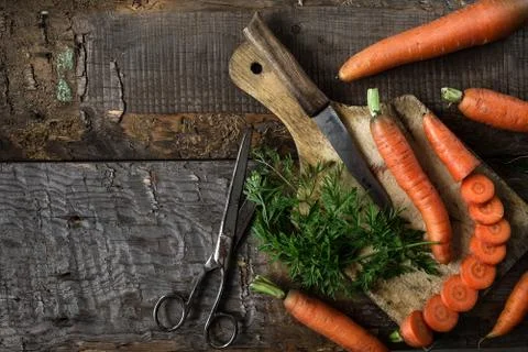Flat lay composition with  carrots on rustic  background. Stock Photos