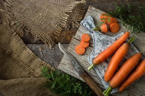 Flat lay composition with  carrots on rustic  background Stock Photos