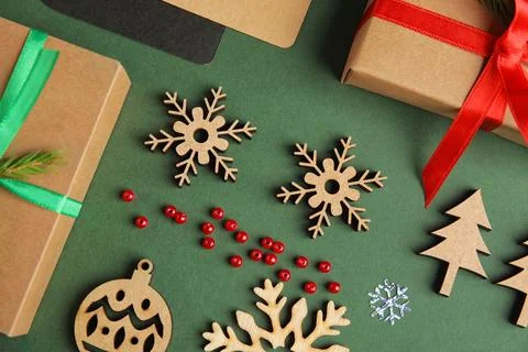 Flat lay composition with Christmas decor on dark green background 스톡 사진