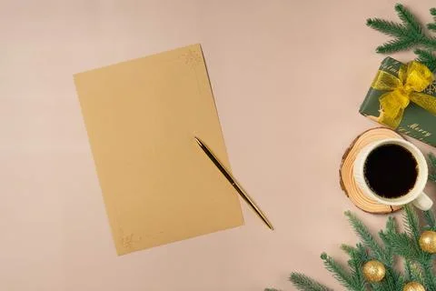 Flat lay composition with Christmas decor and blank card on beige background. Stock Photos
