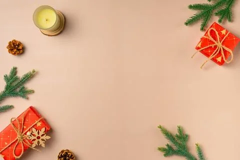 Flat lay composition with Christmas decor and blank card on beige background. Stock Photos
