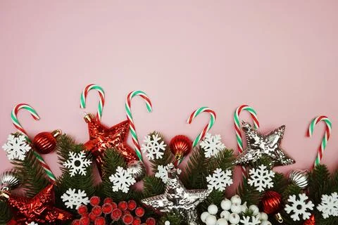 Flat lay composition with Christmas decorations accessories on pink backgroun Stock Photos