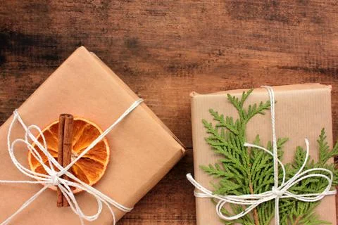 Flat lay composition with Christmas gift boxes wrapped in brown craft paper Stock-Fotos