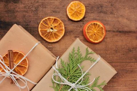 Flat lay composition with Christmas gift boxes in brown craft paper Stock Photos