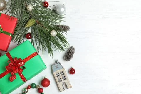 Flat lay composition with Christmas gift boxes on white wooden background. Sp Stock Photos