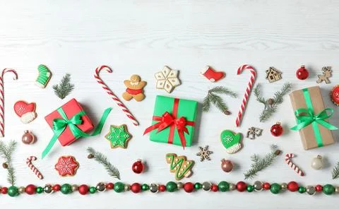 Flat lay composition with Christmas gift boxes on white wooden background Stock Photos