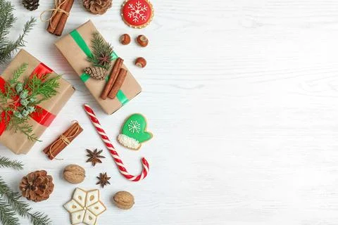 Flat lay composition with Christmas gift boxes on white wooden background. Sp Stock Photos
