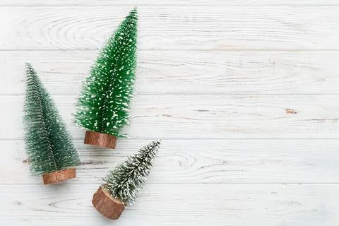 Flat lay composition with christmas trees on color background. Top view with  Stock Photos