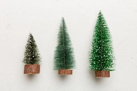 Flat lay composition with christmas trees on color background. Top view with  Stock Photos