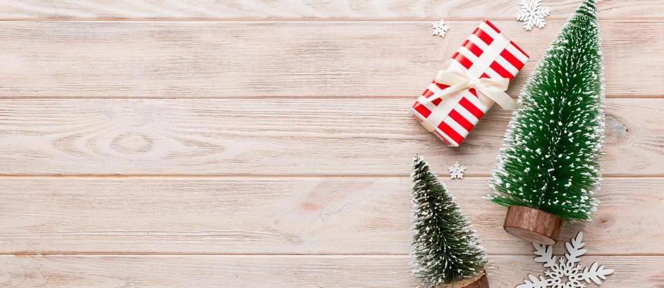 Flat lay composition with christmas trees on color background. Top view wit.. Stock Photos