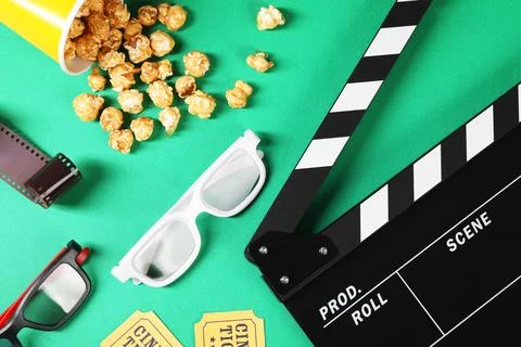 Flat lay composition with clapperboard, movie tickets and 3D glasses on gre.. Stock Photos