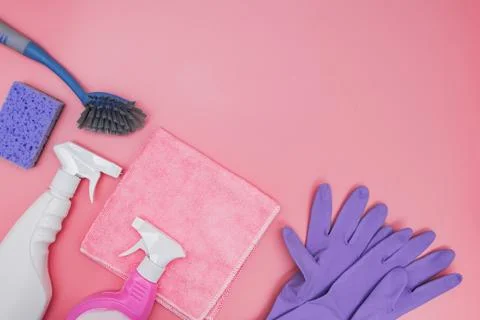 Flat lay composition with cleaning supplies on wooden background Stock Photos