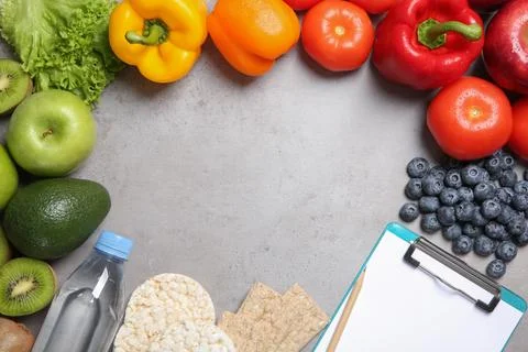 Flat lay composition with clipboard, healthy food and space for text on grey  Stock Photos