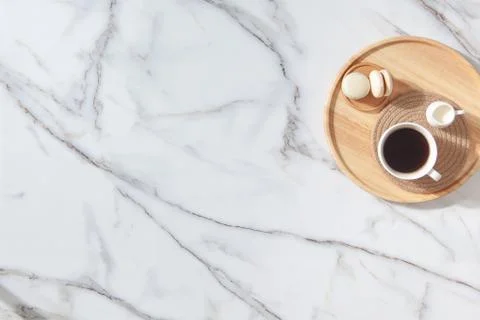 Flat lay composition of coffee, milk and macarons on wooden tray. Marble Stock Photos