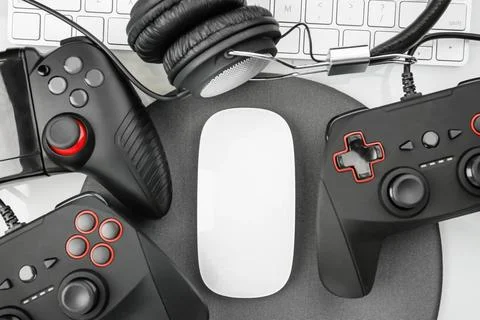 Flat lay composition with computer mouse and gaming gear on table Stock Photos