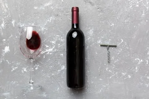 Flat lay composition with corkscrew, bottle of wine and elegant glass on colo Stock Photos