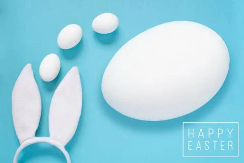 Flat lay composition of creative Easter bunny ears on blue background, space  Photos