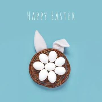 Flat lay composition of creative Easter bunny ears on blue background, space  Stockfoto's