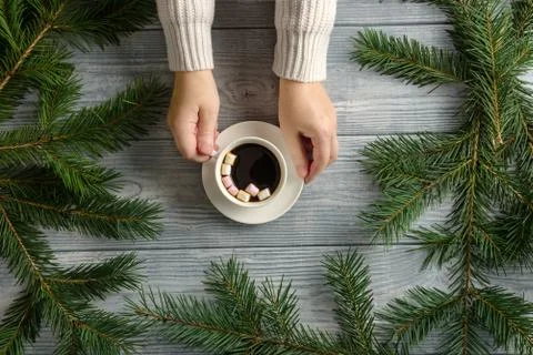 Flat lay composition with a cup of coffee in female hands on the background o Stock Photos